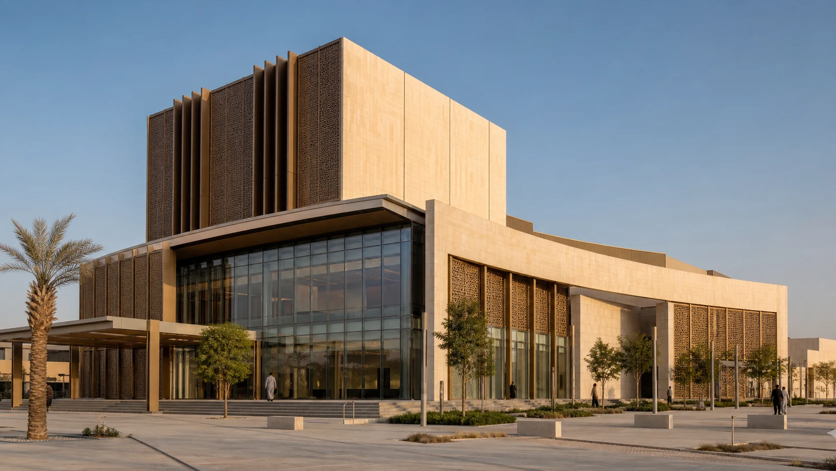 Contemporary Riyadh performing arts venue with a glazed public foyer and bronze solar screens